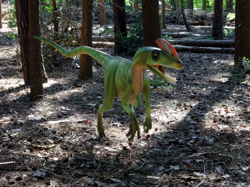 Statue of a Guanlong in the Oertijdwoud forest of the Oertijdmuseum