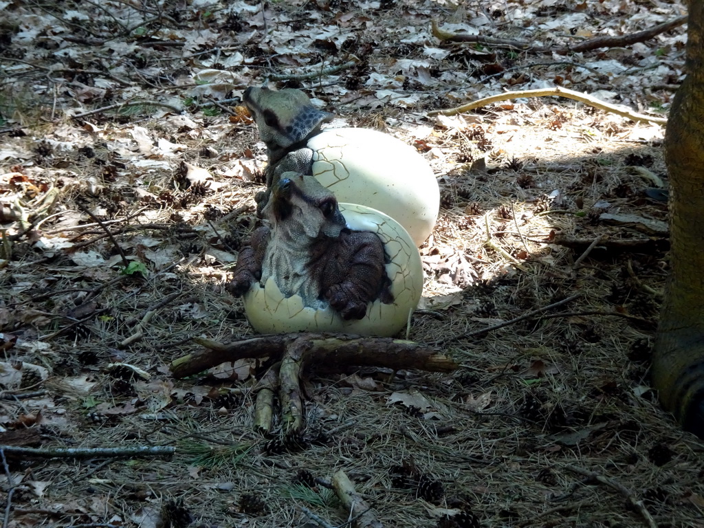 Statues of Triceratops eggs in the Oertijdwoud forest of the Oertijdmuseum