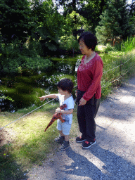 Max and his grandmother at a pond at the Garden of the Oertijdmuseum