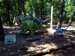 Statue of a Tenontosaurus being attacked by Deinonychuses in the Oertijdwoud forest of the Oertijdmuseum, with explanation