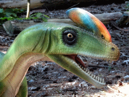 Head of a statue of a Guanlong in the Oertijdwoud forest of the Oertijdmuseum