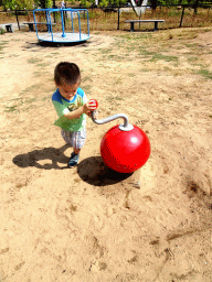 Max at the playground in the Garden of the Oertijdmuseum