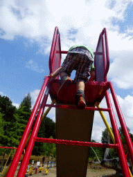 Max on the slide at the playground in the Garden of the Oertijdmuseum