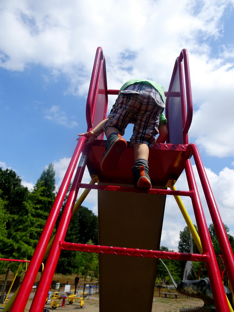 Max on the slide at the playground in the Garden of the Oertijdmuseum