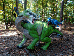 Statue of a Tenontosaurus being attacked by Deinonychuses in the Oertijdwoud forest of the Oertijdmuseum