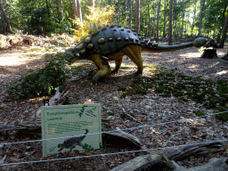 Statue of an Euoplocephalus in the Oertijdwoud forest of the Oertijdmuseum, with explanation