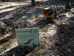 Statue of a Leptoceratops in the Oertijdwoud forest of the Oertijdmuseum, with explanation