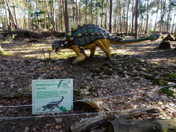 Statue of an Euoplocephalus in the Oertijdwoud forest of the Oertijdmuseum, with explanation