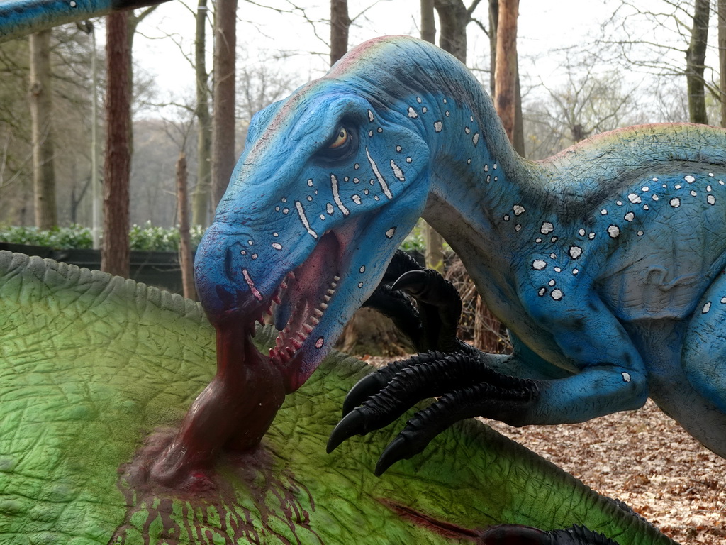 Statue of a Deinonychus attacking a Tenontosaurus in the Oertijdwoud forest of the Oertijdmuseum