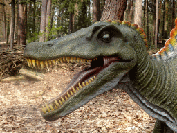 Head of a statue of a Spinosaurus in the Oertijdwoud forest of the Oertijdmuseum
