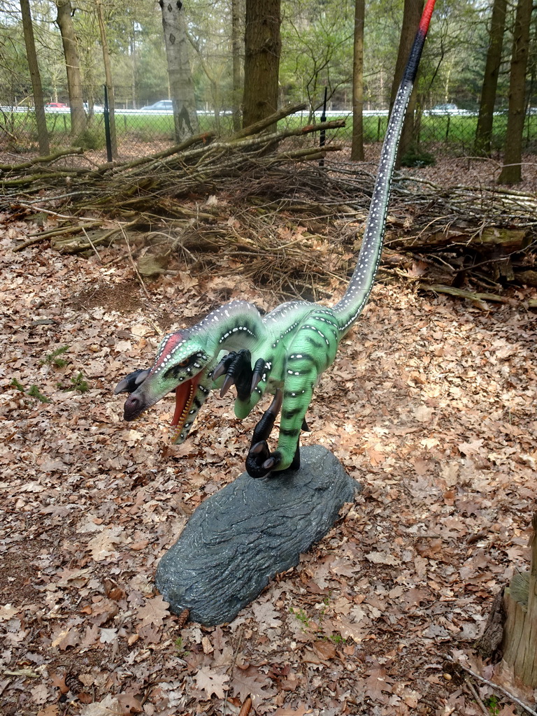 Statue of a dinosaur at the Oertijdwoud forest of the Oertijdmuseum