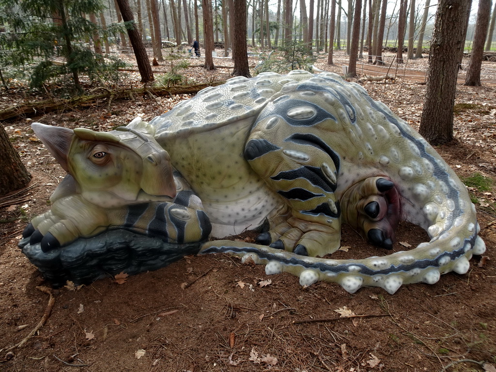 Statue of a dinosaur at the Oertijdwoud forest of the Oertijdmuseum