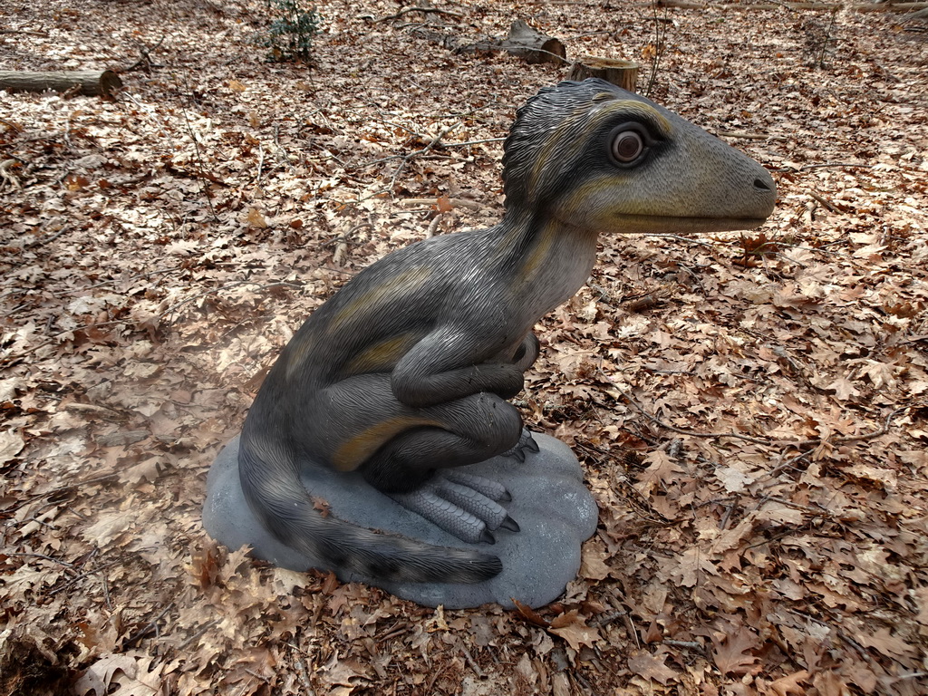 Statue of an Albertonykus at the Oertijdwoud forest of the Oertijdmuseum