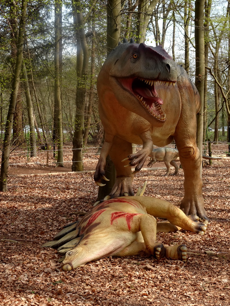 Statues of a Stegosaurus and an Allosaurus at the Oertijdwoud forest of the Oertijdmuseum