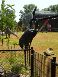 Bird statues in the Garden of the Oertijdmuseum, viewed from the parking lot