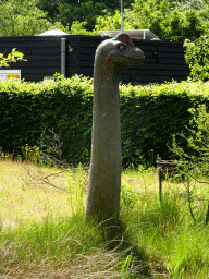 Dinosaur statue in the Garden of the Oertijdmuseum, viewed from the parking lot