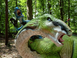 Statue of a Tenontosaurus being attacked by Deinonychuses in the Oertijdwoud forest of the Oertijdmuseum