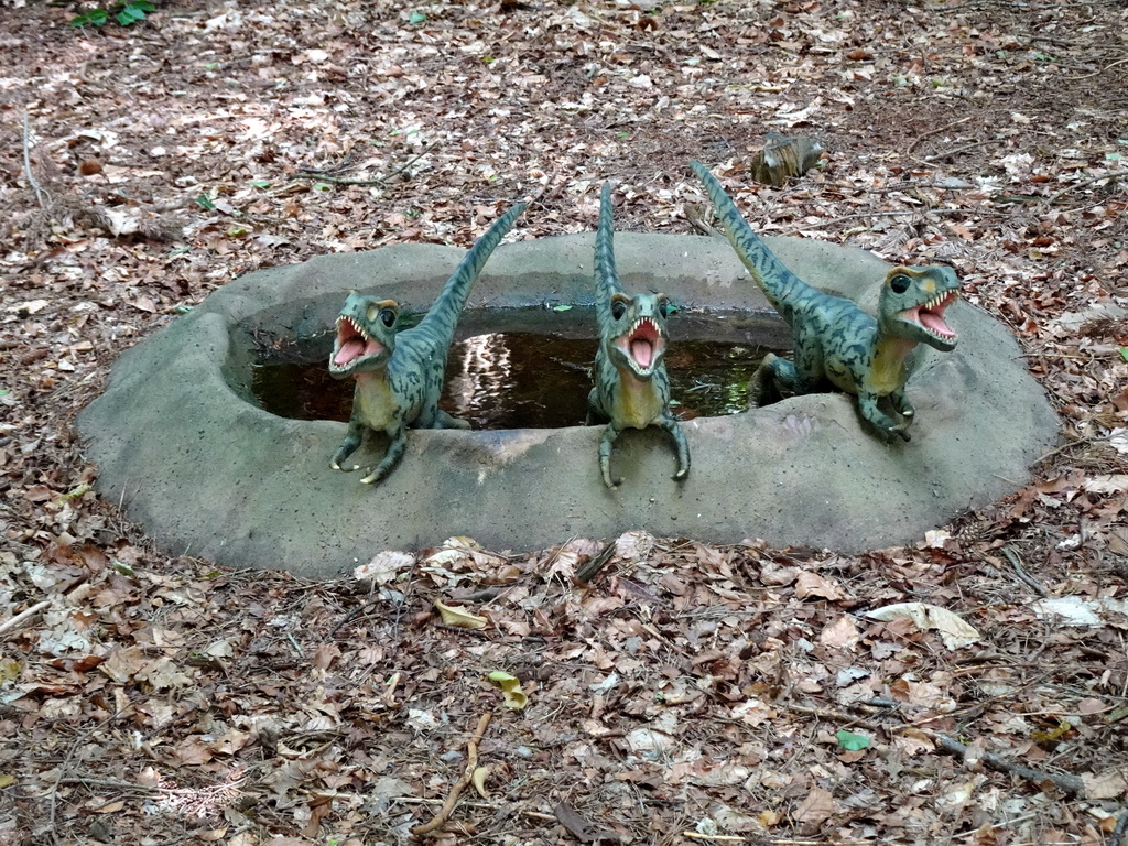 Statues of young Tyrannosaurus Rex in the Oertijdwoud forest of the Oertijdmuseum