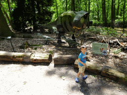 Max with a statue of a Tyrannosaurus Rex in the Oertijdwoud forest of the Oertijdmuseum