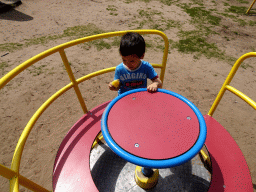 Max with an ice cream at the playground in the Garden of the Oertijdmuseum