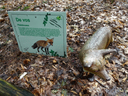 Statue of a Fox in the Oertijdwoud forest of the Oertijdmuseum, with explanation