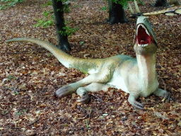 Statue of a dinosaur in the Oertijdwoud forest of the Oertijdmuseum