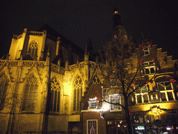 The Grote Kerk church and a pub, by night