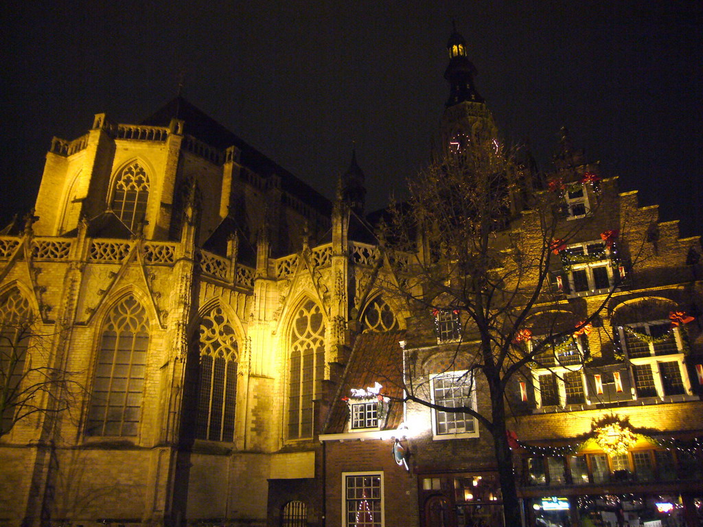The Grote Kerk church and a pub, by night