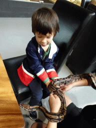 Max with a Ball Python at the lower floor of the Reptielenhuis De Aarde zoo