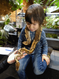 Max with a Ball Python at the lower floor of the Reptielenhuis De Aarde zoo