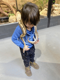 Max with a Ball Python at the lower floor of the Reptielenhuis De Aarde zoo