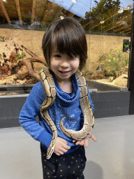 Max with a Ball Python at the lower floor of the Reptielenhuis De Aarde zoo