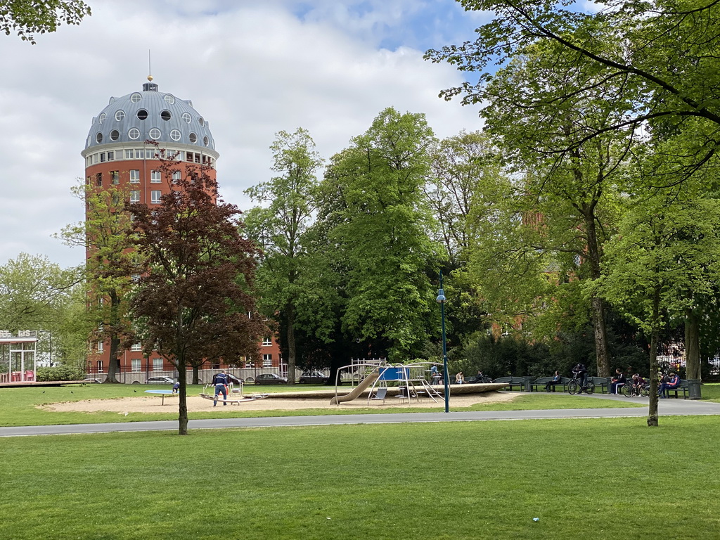 Playground at the Stadspark Valkenberg and a building at the John F. Kennedylaan street