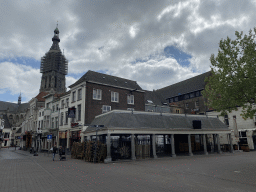 The Vismarkt building at the Haven street and the tower of the Grote Kerk church