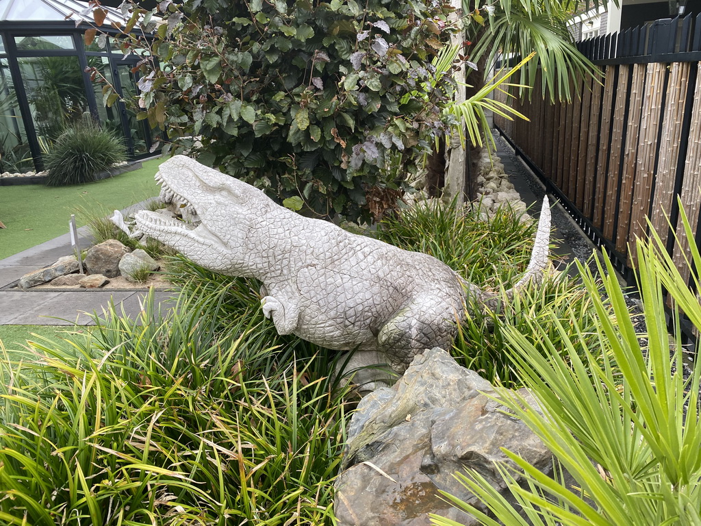 Reptile statue in the garden of the Reptielenhuis De Aarde zoo