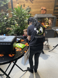 Person doing facial paint at the lower floor of the Reptielenhuis De Aarde zoo, during the Halloween 2020 event