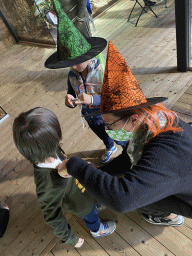 Max and his friend with their snake buttons at the upper floor of the Reptielenhuis De Aarde zoo, during the Halloween 2020 event