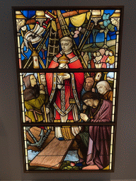 Stained glass window with the Sacrament of Niervaert at the `De Collectie - 450 jaar kunst en geschiedenis` exhibition in Room 1 at the Ground Floor of the Stedelijk Museum Breda