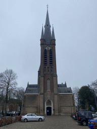 West side and tower of the Sint-Martinuskerk church, viewed from the parking lot