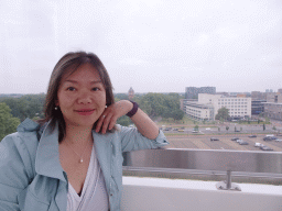 Miaomiao in our capsule at the Smakenrad ferris wheel at the Chasséveld square, with a view on the Watertoren tower at the Wilhelminasingel street and the Breda Police Office
