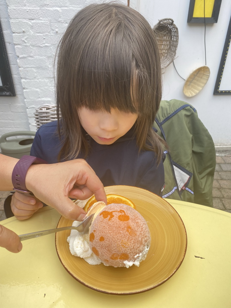 Max with a `Naranja` dessert at the terrace of the FEBO Tapas restaurant