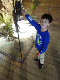 Max with a Savannah Monitor at the upper floor of the Reptielenhuis De Aarde zoo, with explanation