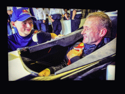 Photograph of Max Verstappen and Jos Verstappen in a race car in 2011, at the `Vleugels to the Max` exhibition at the Koepelgevangenis building