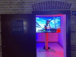 Screen with images of Max Verstappen at his Formula 1 debut at Melbourne in 2015, at the `Vleugels to the Max` exhibition at the Koepelgevangenis building, with explanation