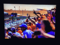 Photograph of the race cars and crowd at the Formula 1 race at Zandvoort in 2021, at the `Vleugels to the Max` exhibition at the Koepelgevangenis building