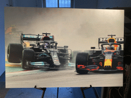 Photograph of Max Verstappen and Lewis Hamilton in Formula 1 cars at the `Vleugels to the Max` exhibition at the Koepelgevangenis building