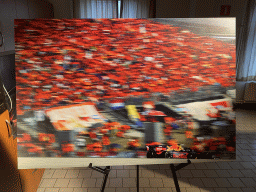 Photograph of Max Verstappen in a Formula 1 car and the `Orange Army` in 2019, at the `Vleugels to the Max` exhibition at the Koepelgevangenis building