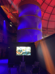 Staircase and a screen with Max Verstappen in a Formula 1 car, at the `Vleugels to the Max` exhibition at the Koepelgevangenis building