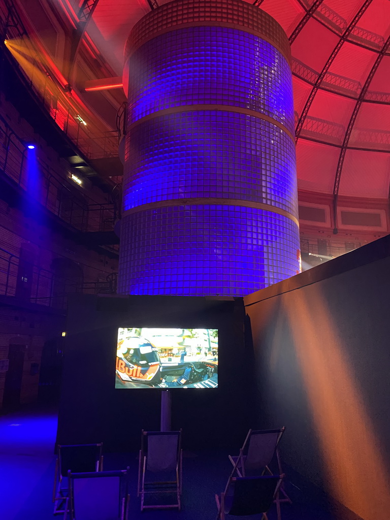 Staircase and a screen with Max Verstappen in a Formula 1 car, at the `Vleugels to the Max` exhibition at the Koepelgevangenis building