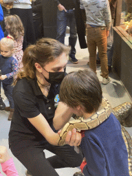 Max and a zookeeper with a Ball Python at the lower floor of the Reptielenhuis De Aarde zoo